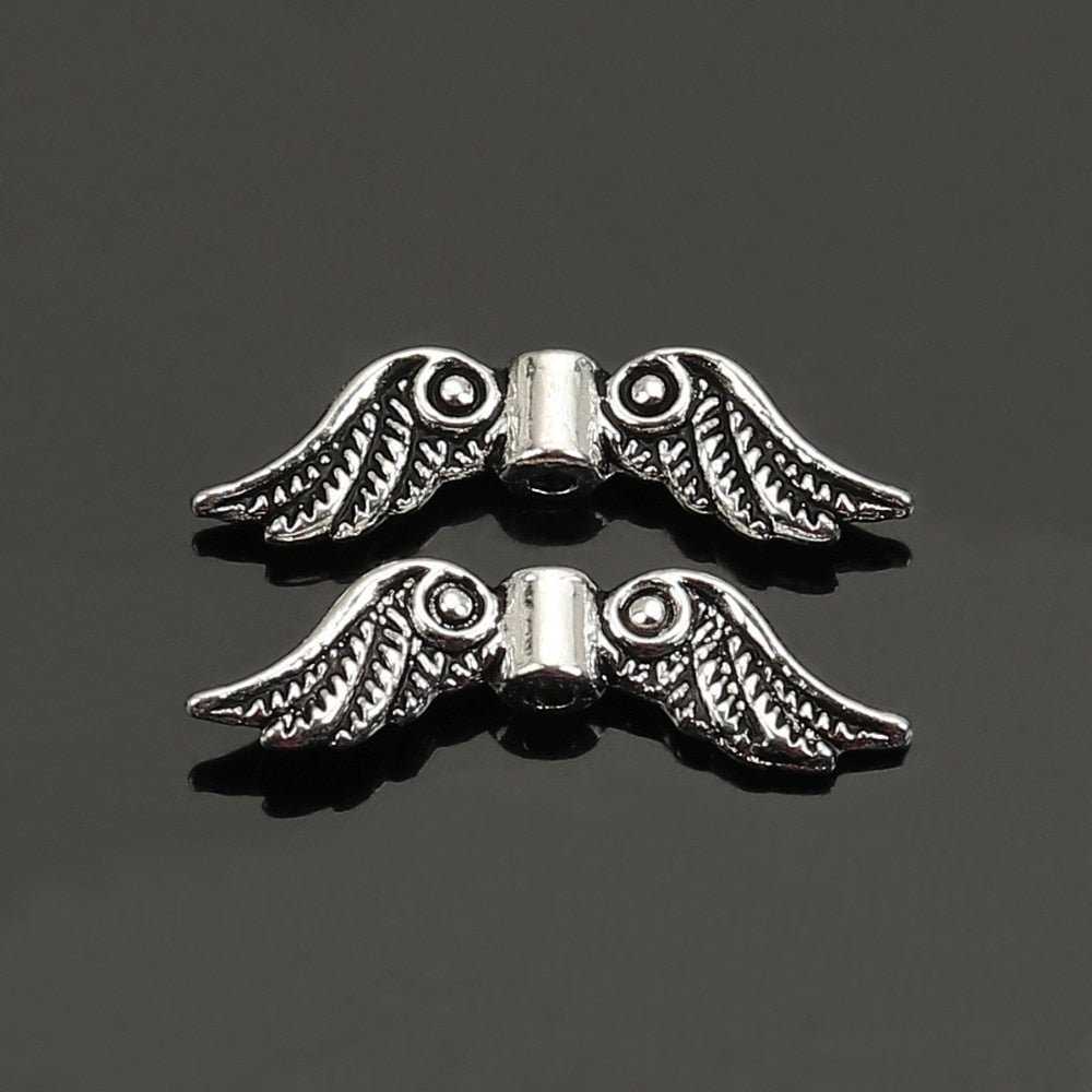 DoreenBeads 50 Pieces Antique Silver Color Angel Wing Charm Spacers Beads 23x7mm Jewelry Making Accessories For DIY (B05959)